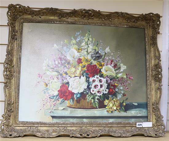 G Rock, oil on canvas, Still life of flowers in a basket on a ledge, signed and dated 50, 51 x 66cm.
